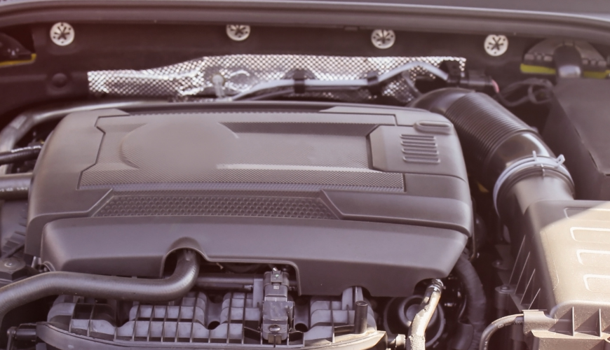 Car hood open with engine highlighted