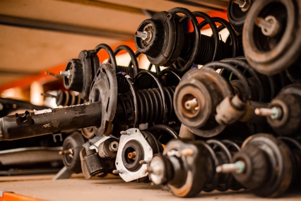 Several used car parts stocked in a shelve