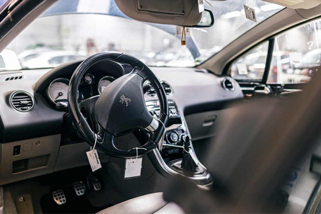 A steering wheel catalogued is still installed on the car.