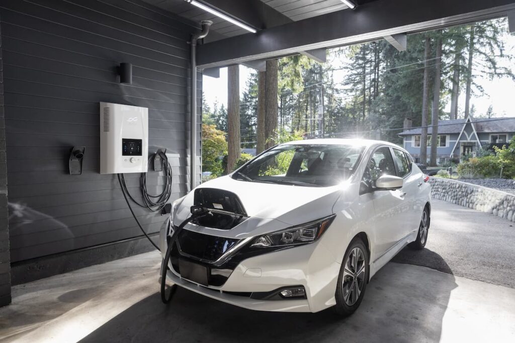 White electric car charging in a private garage