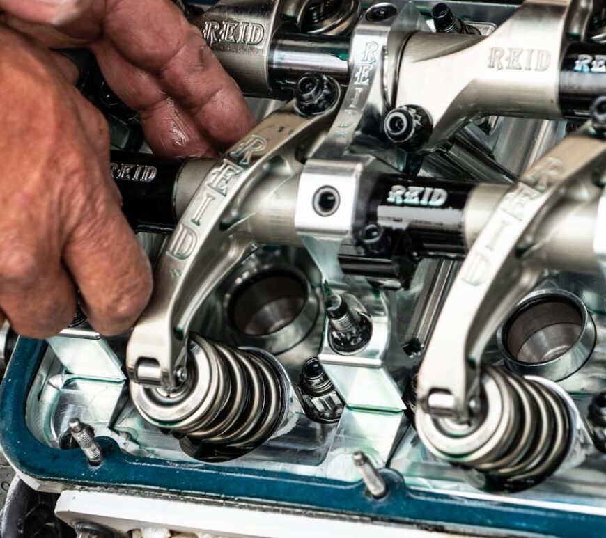 Man checking car components